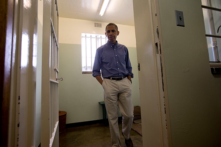 Obama Robben Island: President Back Obama walks from Section B, prison cell No. 5, on Robben Isl