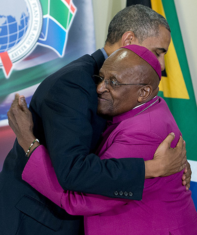 Obama Robben Island: President Barack Obama embraces Desmond Tutu following a tour of the Desmon