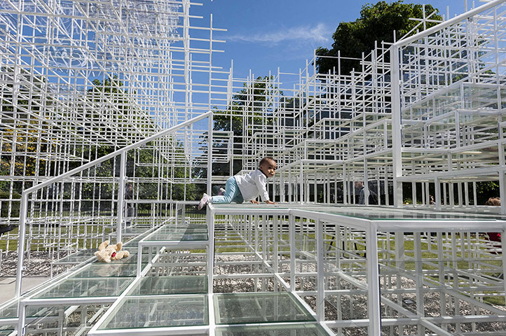 Serpentine pavilion: 18 month old toddler Helmi enjoys climbing on Sou Fujimoto's Pavilion