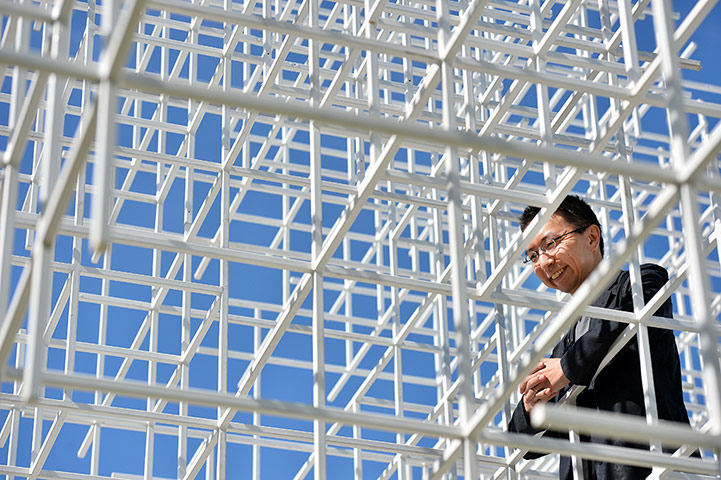 Serpentine pavilion: Japanese architect Sou Fujimoto poses in the Serpentne pavilion