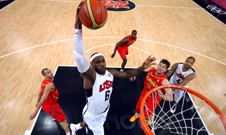 LeBron James (L) of the US dunks during