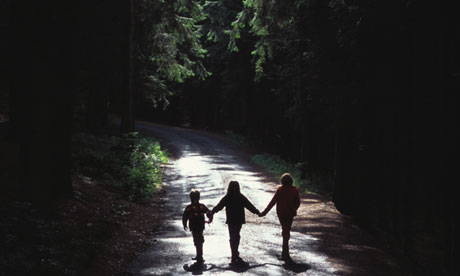 Three children holding hands 