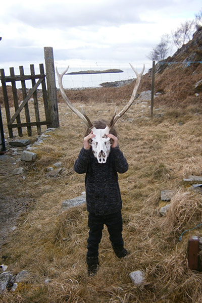In pictures: Weekend readers' best photographs-boy and deer skull