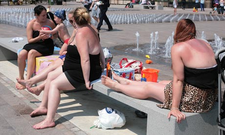 Laura Alexander and son, Elise Murphy, Tammy Paul and Amy Baxter sunbathing in London, 6 June.