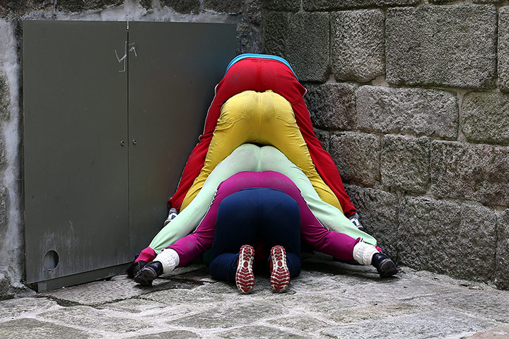 Urban bodies: Performers squeeze into a corner