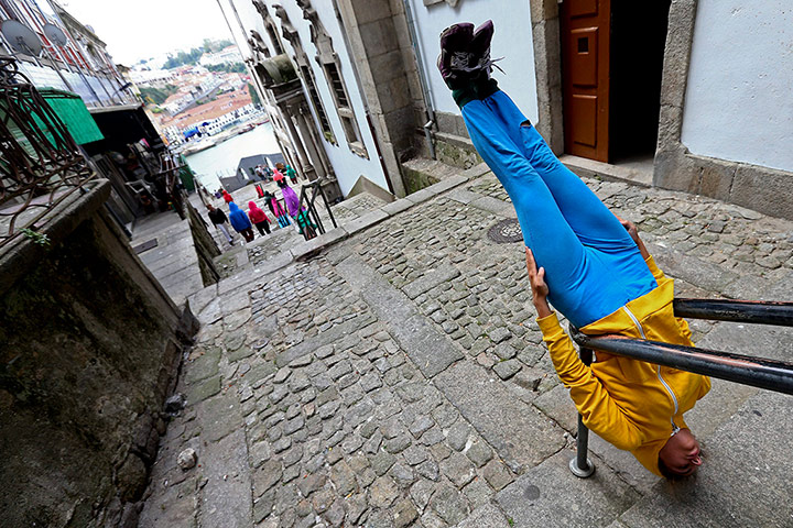 Urban bodies: A performer on a handrail