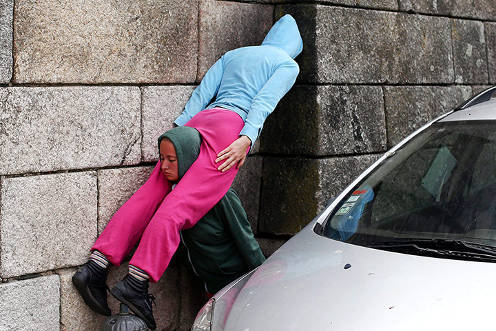 Urban bodies: Two performers entwined