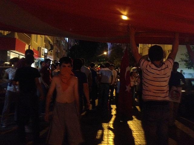 Turkey demonstrations: child under turkish flag