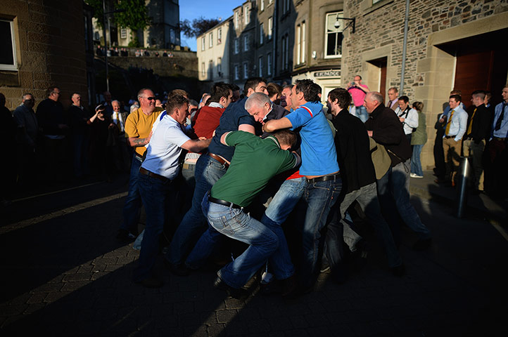 Hawick common riding: Men take part in the snuffin' by the site of Auld Brig