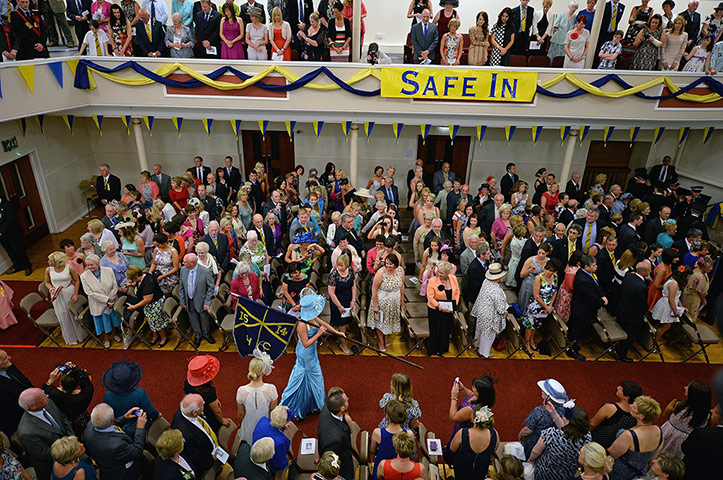 Hawick common riding: cornet's Lass Heather Amos enters the town hall for the colour bussing