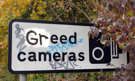 Speed camera sign vandalised with graffiti