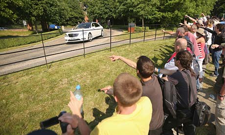 Demonstrators protest against people arriving for the Bilderberg group summit in Watford