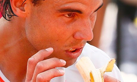 Rafael Nadal has a banana during his quarter-final match in the French Open