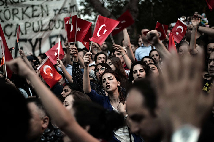 20 Photos: Demonstrators wave Turkish flags at Gazi park next to Taksim square