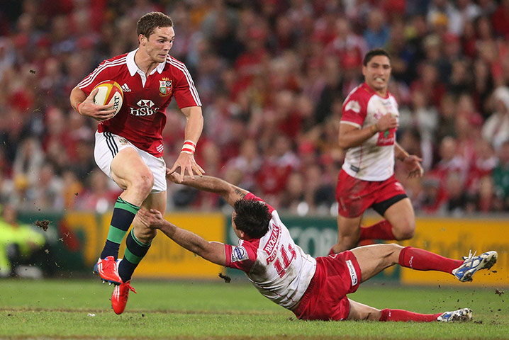 British & Irish Lions v Reds: George North of the Lions evades Rod Davies 