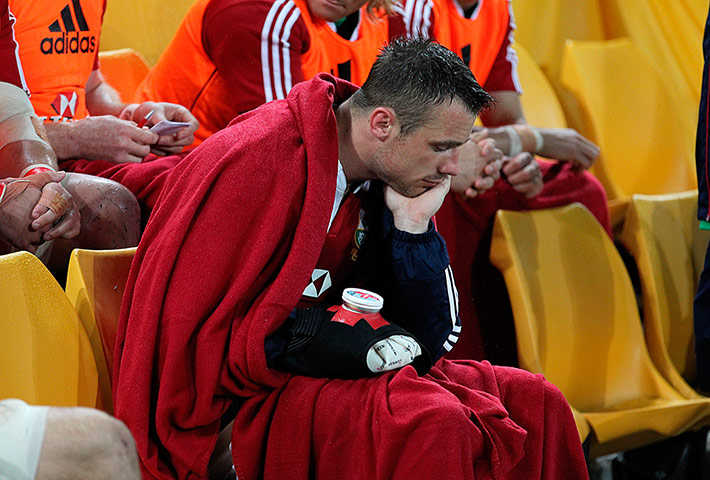 British & Irish Lions v Reds: Tommy Bowe sits on the bench after being substituted with a hand injury