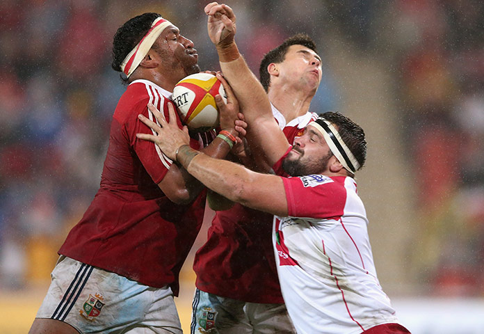 British & Irish Lions v Reds: Lions players Mako Vunipola (left) and Ben Youngs are tackled by James Hanson