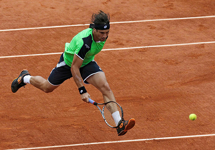 sport2: David Ferrer of Spain hits a return to compatriot Rafael Nadal during their