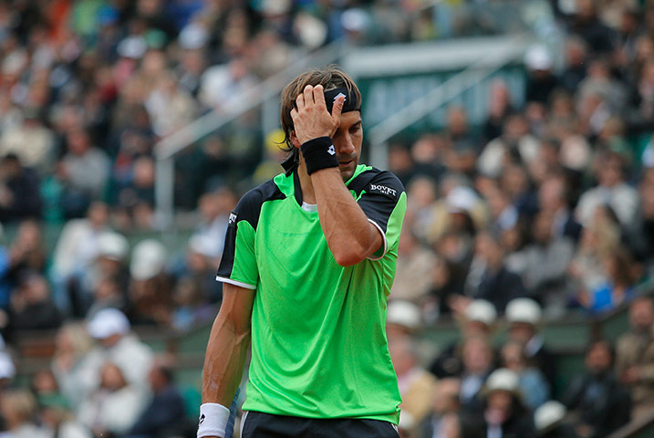 tennis2: Spain's David Ferrer reacts as he plays compatriot Rafael Nadal during the 