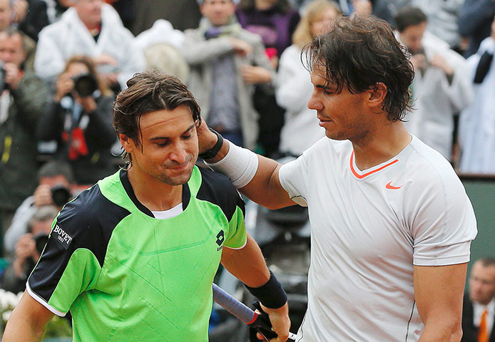 tennis7: Rafael Nadal (R) of Spain pats compatriot David Ferrer on the back after wi