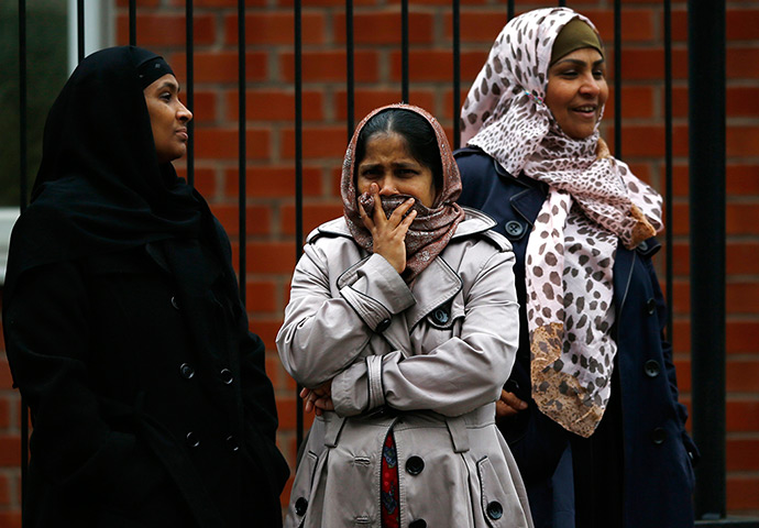 Smethwick fire: A woman covers her mouth near the fire. The factory unit has claimed that t