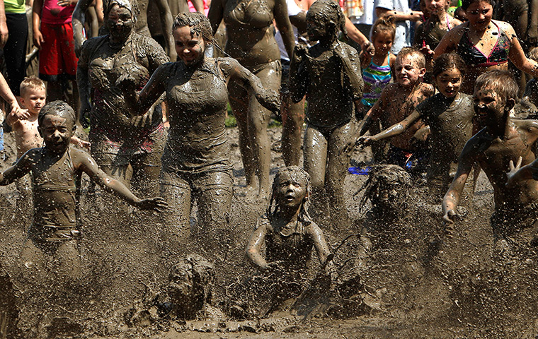 Mud day: Children run into the mud