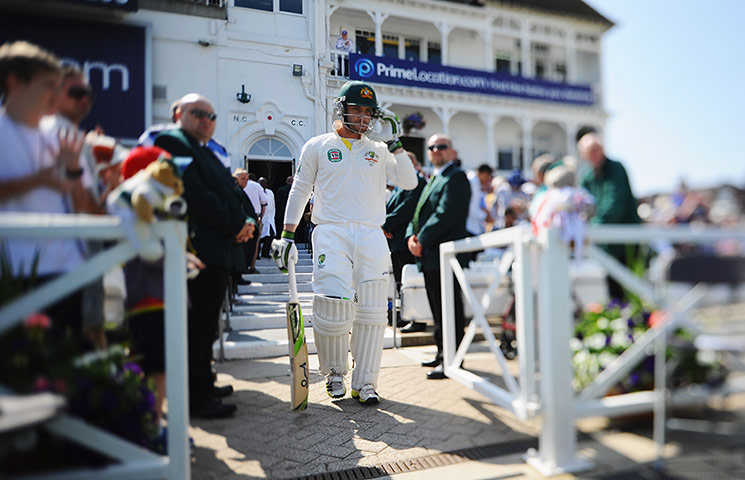 Ashes first test day 2: Phil Hughes of Australia walks out to bat 