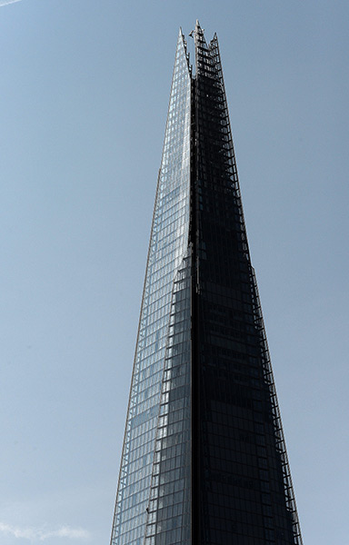 Greenpeace Shard: An activist (bottom left) makes her way slowly up the Shard