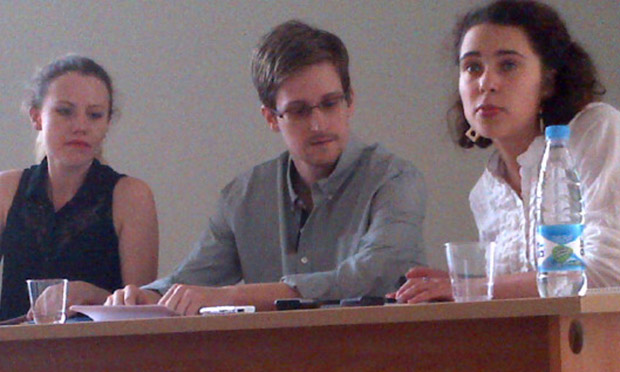 Edward Snowden along with Sarah Harrison of WikiLeaks (left) at a press conference in Sheremetyevo