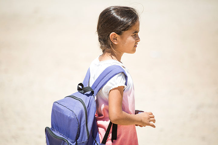 Eddie Izzard: A young Syrian refugee makes her way to a primary school in Domiz camp