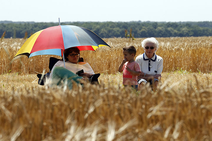 tour de france: Supporters wait for riders along the road