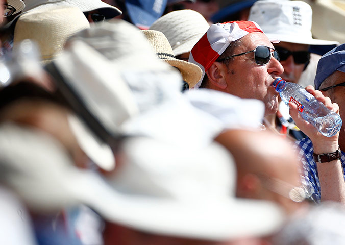 weather: An England cricket fan wearing a knotted handkerchief 