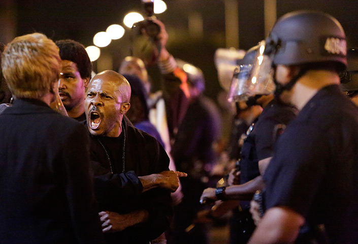 Zimmerman not guilty: A protester  shouts as  police try to remove protesters in Los Angeles