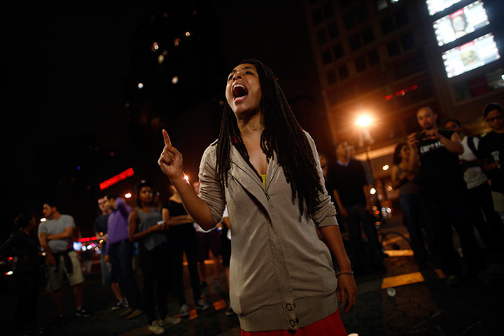 Zimmerman not guilty: A woman reacts to the news of Zimmerman verdict in New York