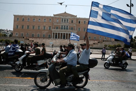 Municipal police officers take part in a protest with motorbikes against public sector layoffs, which the government has promised its international lenders in exchange for bailout funds, in Athens July 15, 2013.