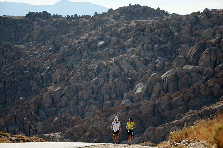 FTA: Lucy Nicholson: Carlos Alberto Gomes De Sa of Portugal, right, walks with his pacesetter on