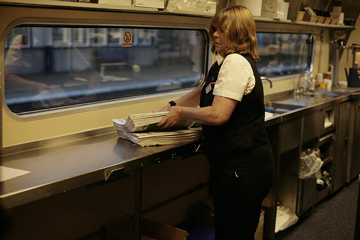 Night Riviera: Putting out the morning papers for the passengers