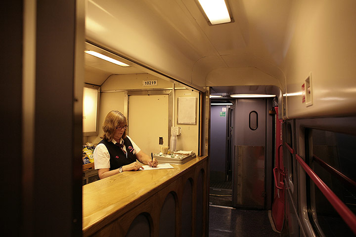 Night Riviera: A staff member at work in the buffet car