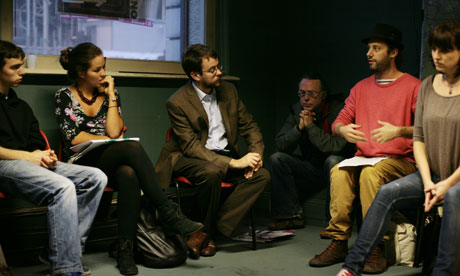 People gathered in a circle to discuss ideas