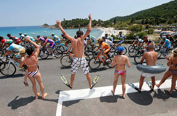 cycling fans: Fans encourage the pack of riders