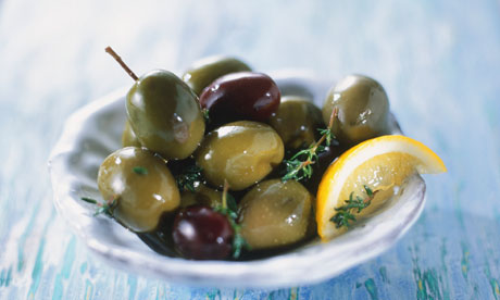 Small plate of green and black olives