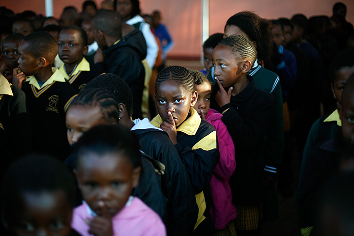 Mandela's birthday: Pupils at the Denver Primary School in Johannesburg, South Africa, gesture 