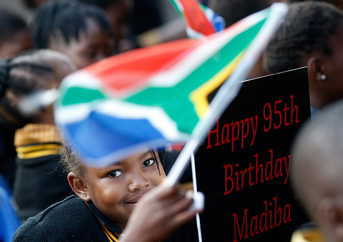 Mandela's birthday: Children hold placards at a township school in Atteridgeville near Pretoria