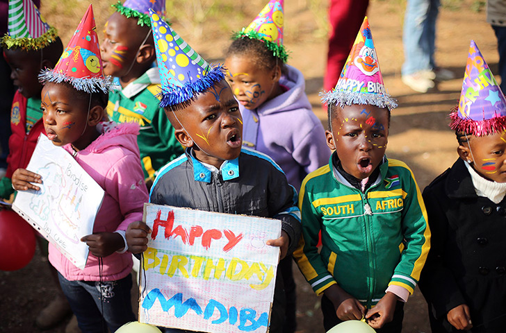 Mandela's birthday: Children wear hats outside the Medi-Clinic Heart Hospital, where Mandela is