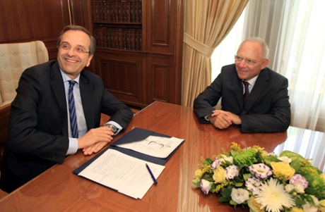 epa03791654 Greek Prime Minister Antonis Samaras (L) talks with German Finance Minister Wolfgang Schaeuble (R) during their meeting at the Maximon Mansion in Athens, Greece, 18 July 2013.