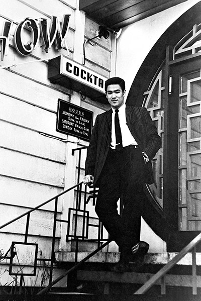 Bruce Lee: Bruce Lee on the steps of Ruby Chow's restaurant in Seattle, where he worke