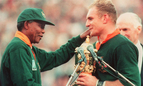 Francois Pienaar receives the Rugby World Cup from South African President Nelson Mandela 