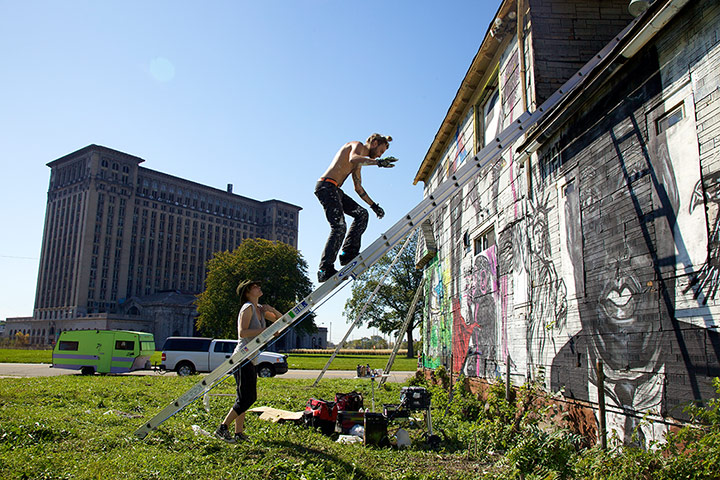 motor city blues: Artists paint the walls of Imagination Station, a house across from Detroit