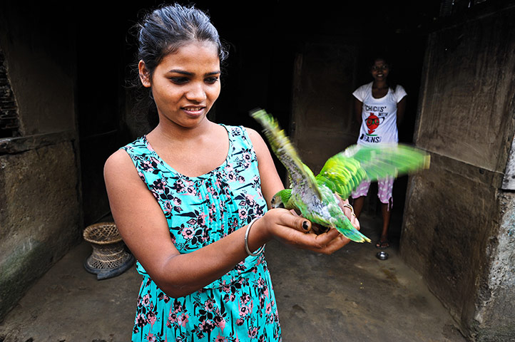 Indian Slavery: Elaina Kujar, 20, in her home in Dolahat tea estate