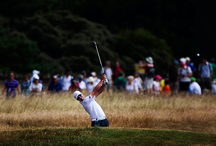 Open Golf : Zach Johnson plays a fairway iron on the 9th during the opening round